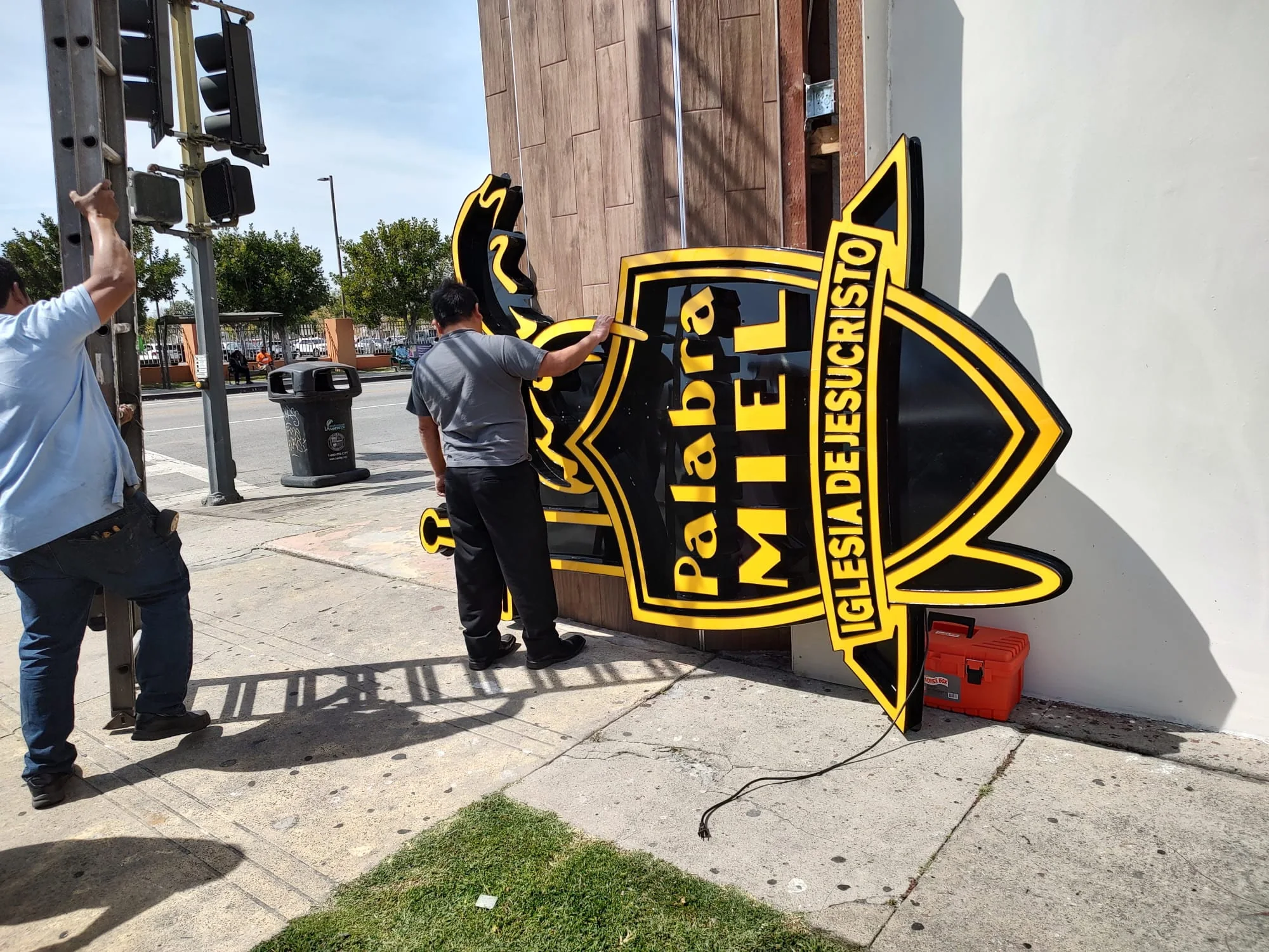 Large custom logo sign during installation