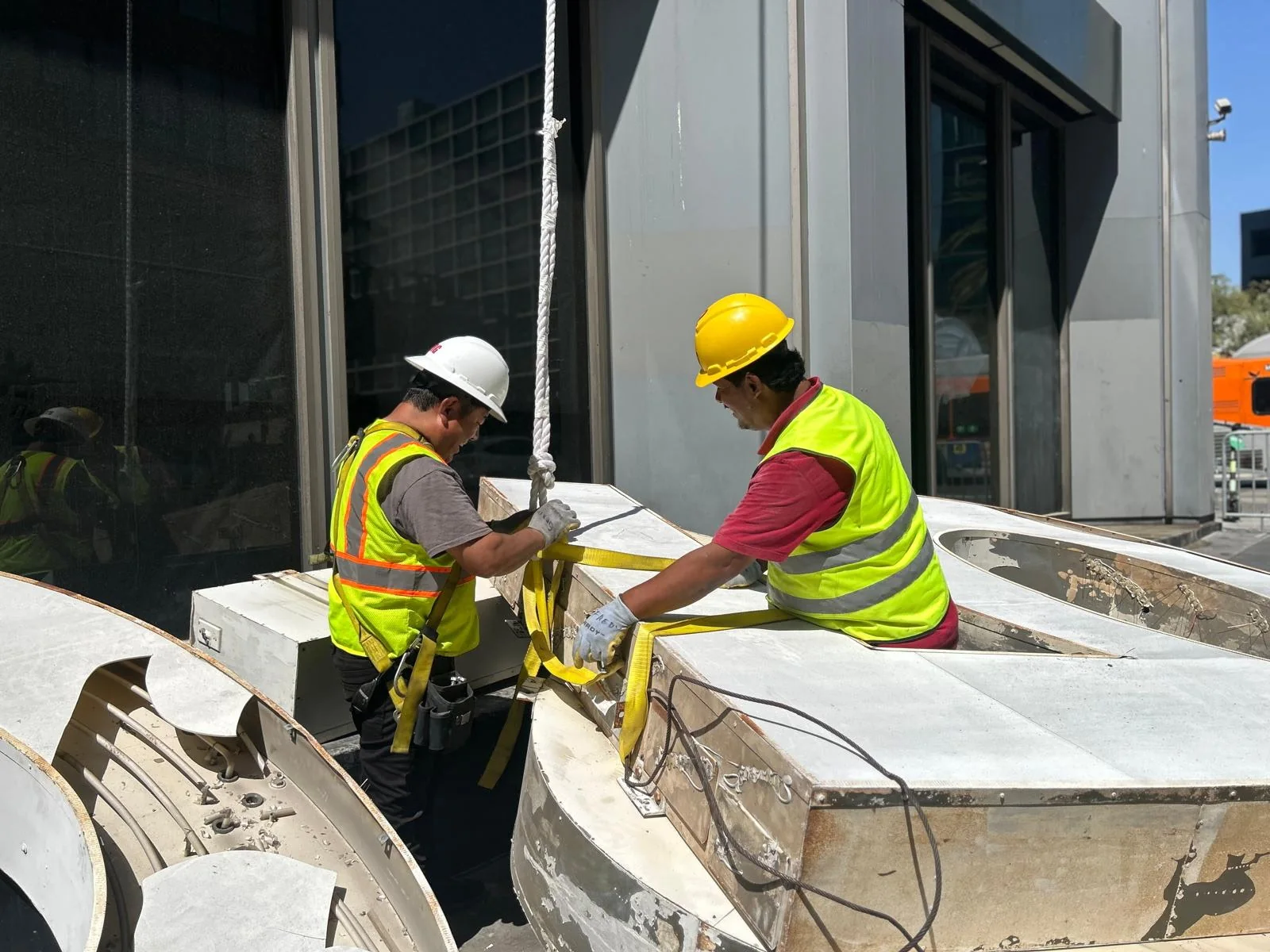 Sign crew rigging a commercial sign