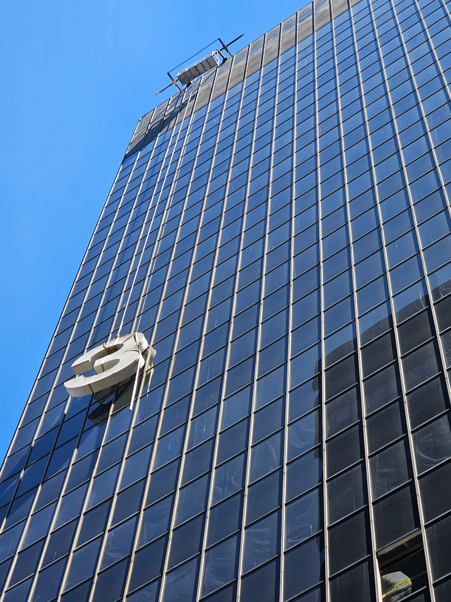 High-rise commercial sign installation